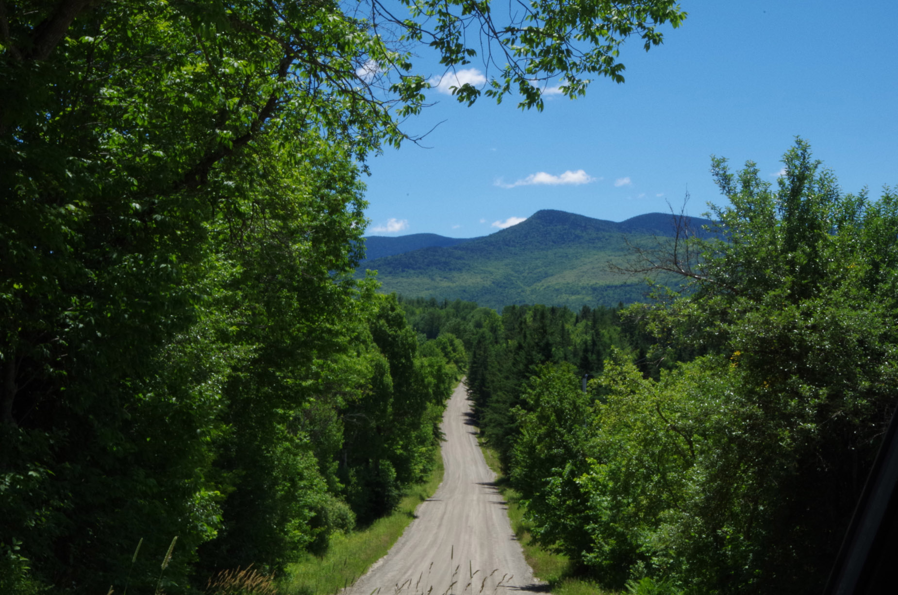 dirt road summer with mountains